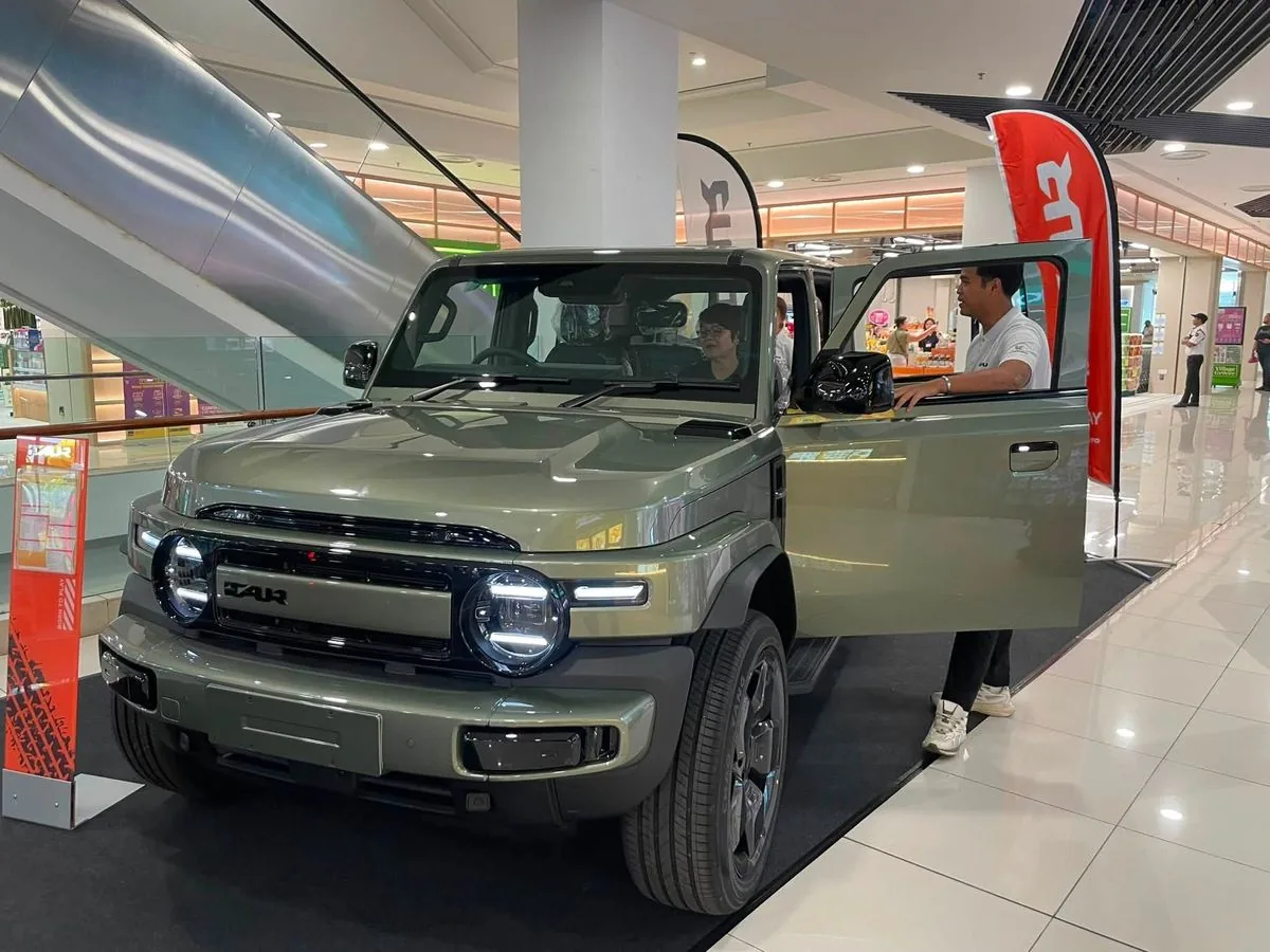 Army Green iCAUR V23 on display with doors open at a roadshow stand